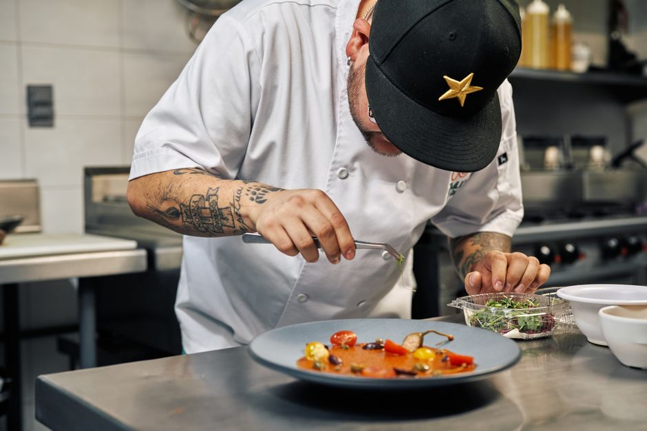 Chef carefully plating a gourmet dish